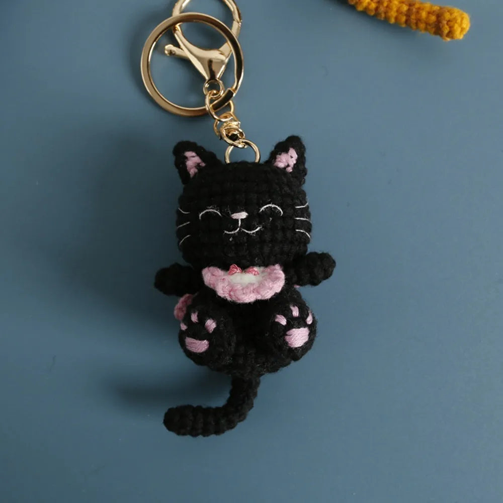 Handmade black smiling kitten keychain