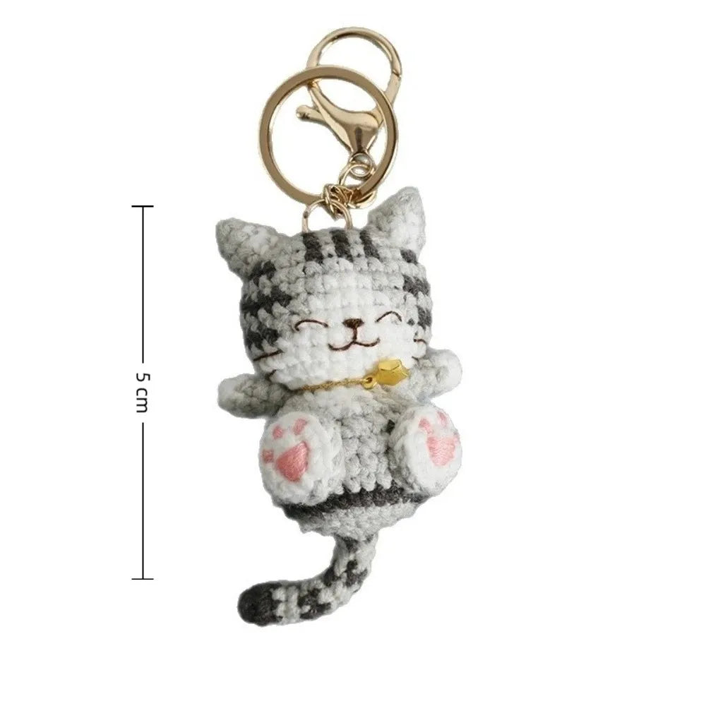 Handmade gray smiling kitten keychain